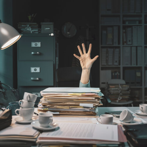 office worker overwhelmed by work