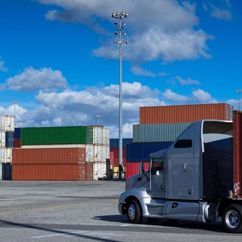 shipping containers with a truck in front