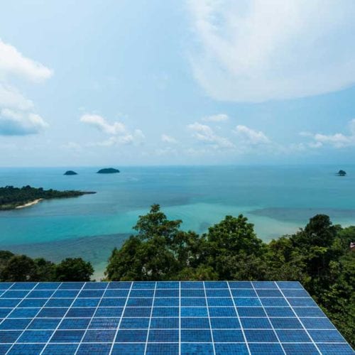 ocean islands with solar panels in foreground