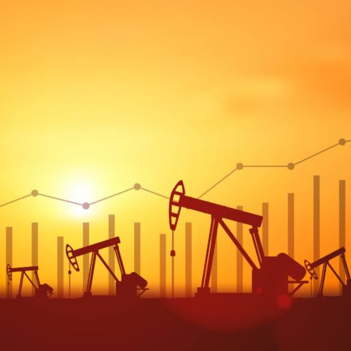 Silhouette Oil pumps at oil field with sunset