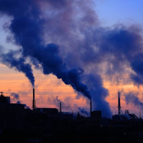 factory pollution smoke billowing out