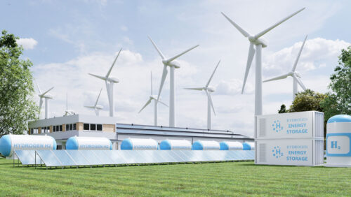 hydrogen storage tanks with wind turbines in background
